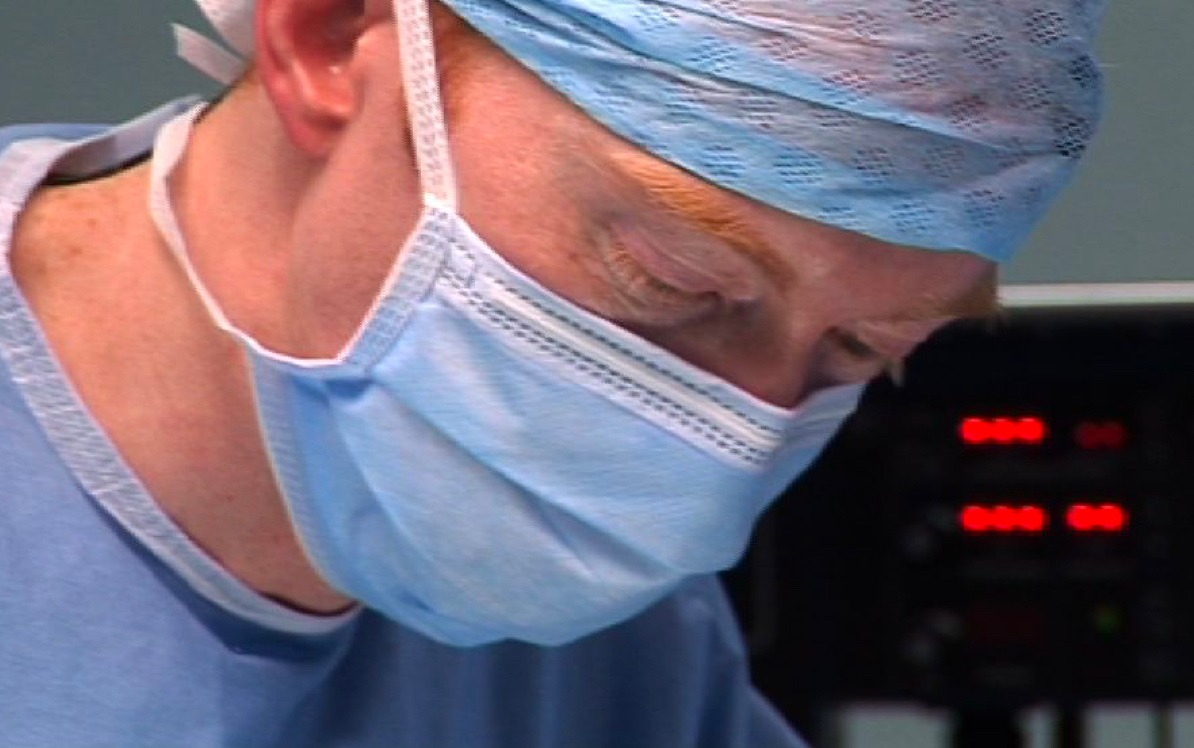 Photo of Andy Moores in surgery, operating
